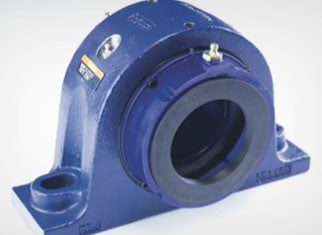 Integrated self-aligning roller bearing with seat unit